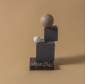 Stacks of cubes beside beside sphere shape balls